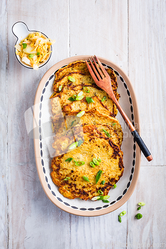 Image of Homemade potato pancakes with cabbage salad and green onions