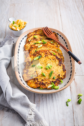 Image of Homemade potato pancakes with cabbage salad and green onions