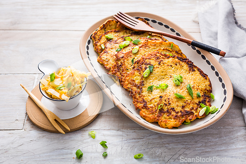 Image of Homemade potato pancakes with cabbage salad and green onions