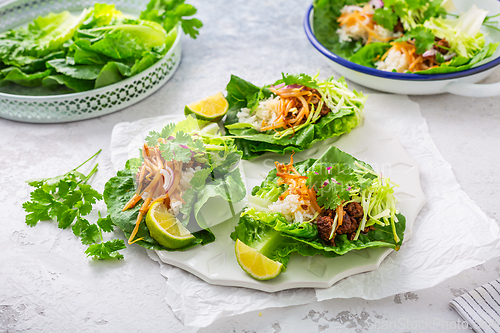 Image of Asian minced meat lettuce wraps with rice, bean sprouts and cabbage