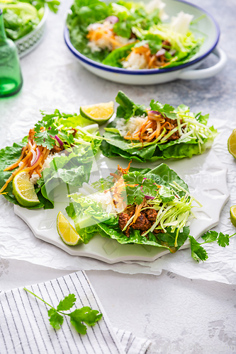 Image of Asian minced meat lettuce wraps with rice, bean sprouts and cabbage