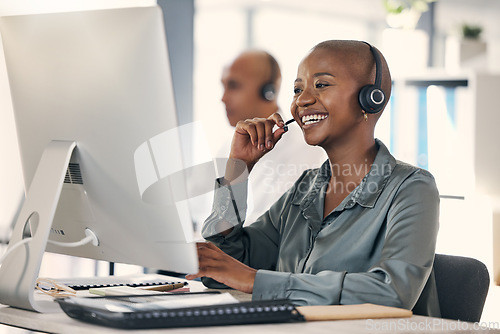 Image of Customer service, woman call center agent with headset and computer at her desk of a modern workplace office. Telemarketing or online communication, consultant and African female person for support