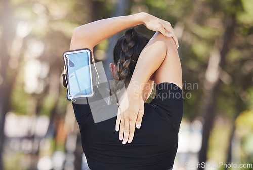 Image of Fitness, runner or woman stretching arms ready for workout, exercise or workout or body movement. Phone, back view of athlete or healthy girl in running warm up for flexibility or mobility in park