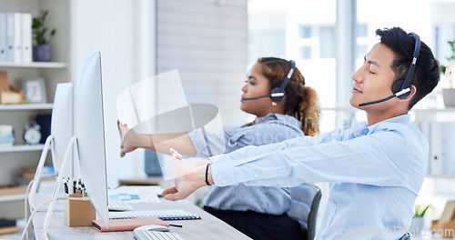 Image of Call center, tired and a team stretching at desk with a computer and headset for telemarketing. Diversity office with man and woman agent exercise to relax or start sales, customer service or support