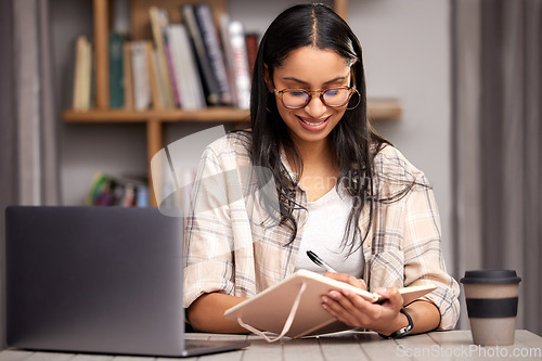 Image of Laptop, writing and education with a student woman in a university library to study for a final exam. Technology, learning and notebook with a young female college pupil reading research material