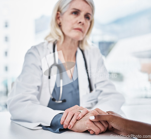 Image of Empathy, sad and holding hands of doctor and patient for medical, consulting and advice. Medicine, healthcare and help with closeup of people in hospital for depression, compassion and hope