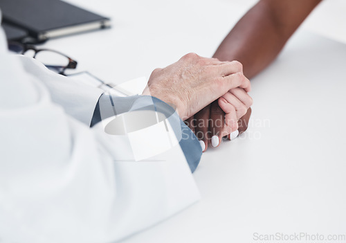 Image of Empathy, trusts and holding hands of doctor and patient for medical, consulting and advice. Medicine, healthcare and help with closeup of people in hospital for depression, compassion and hope