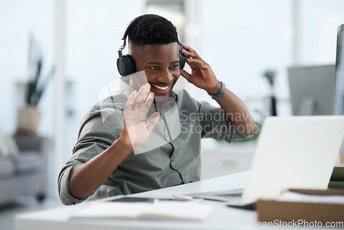 Image of Happy black man, laptop and video call with headphones for webinar, virtual meeting or introduction at the office. Friendly African male person, consultant or agent smiling with headset for seminar