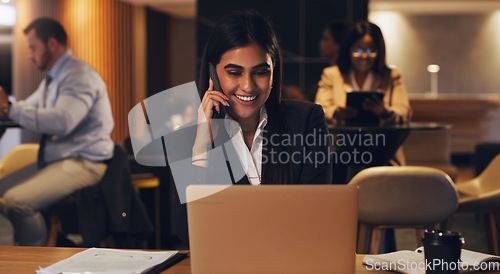 Image of Happy phone call, laptop and professional woman speaking, talk or negotiation with business investment contact. Coworking lounge, night consultant and person consulting, planning or chat on cellphone