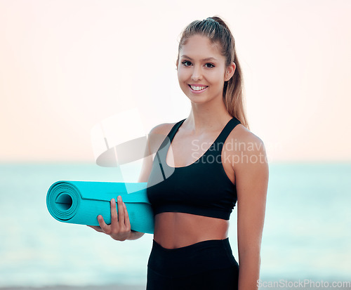 Image of Beach, yoga mat and portrait of woman outdoor for health, fitness and ocean mockup. Face, pilates and happy female athlete from Canada ready to start exercise, body workout or training at sunset.