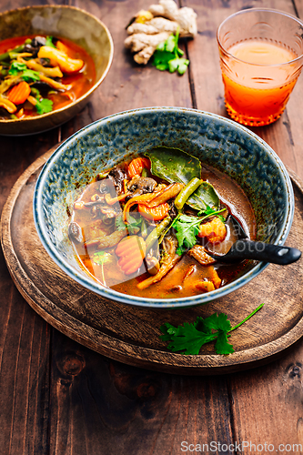 Image of Thai red vegetarian curry with mushrooms and vegetables