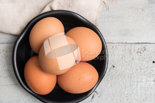 Image of Eggs in black bowl