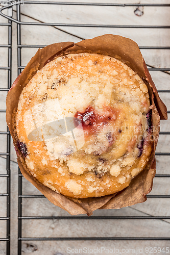 Image of Muffins with red fruits jam fill.