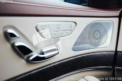Image of Car inside. Interior of prestige modern car. Climate control, hi-end sound speakers, seat memory, door lever