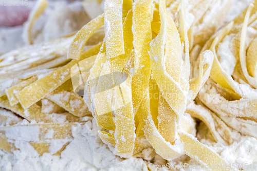 Image of raw pasta with flour