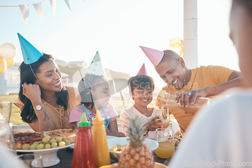 Image of Birthday, parents and kids with food in park for event, celebration and party outdoors together. Family, social gathering and mother, father with children at picnic with juice, presents and cake