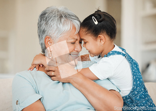 Image of Family, girl and grandmother with forehead touch, happiness and bonding with smile and affection at home. Love, care and trust with elderly woman and young child happy with hug in living room