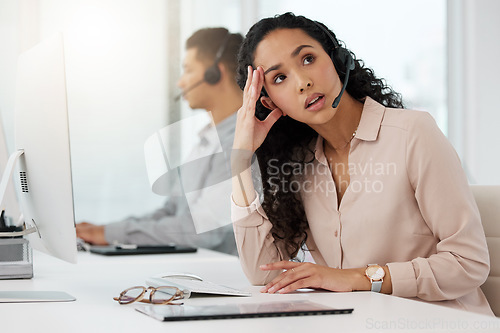 Image of Business woman, call center and frustrated in stress, burnout or customer service at office. Annoyed and tired female person, consultant or agent talking to difficult client or complaint at workplace