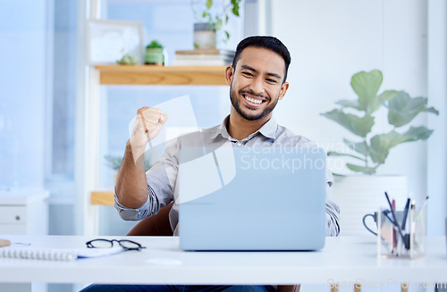Image of Laptop, business and a man celebrate success or win at desk with fist for bonus deal or growth. Excited Asian businessman with tech for sales profit, competition or online achievement notification