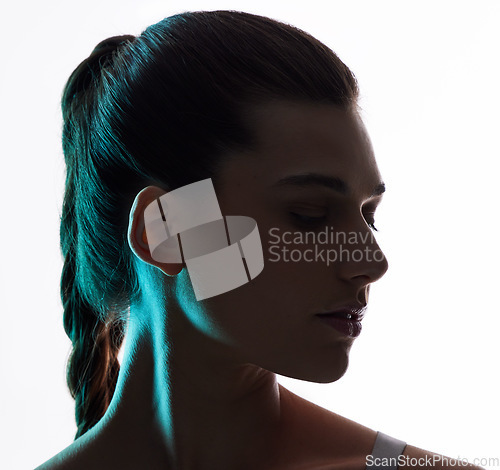 Image of Beauty, neon and silhouette with profile of woman in studio for creative, glow and lighting mockup space. Fantasy, shadow and shine with model on white background for art, disco and dark aesthetic