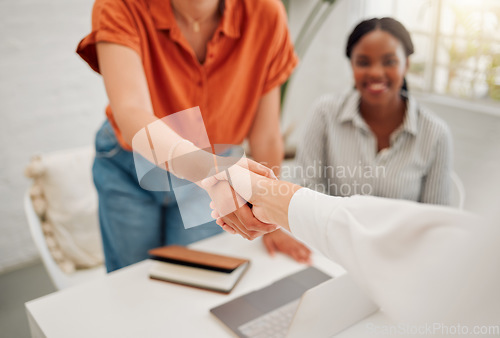 Image of Business people with a handshake in the office for corporate deal, partnership or collaboration. Meeting, welcome and closeup of female employees shaking hands for an onboarding, hiring or agreement.