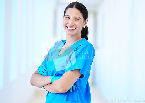 Image of Woman, nurse smile and portrait with arms crossed and job in a hospital and clinic. Employee, healthcare and wellness professional with happiness and confidence from doctor and medical work and care