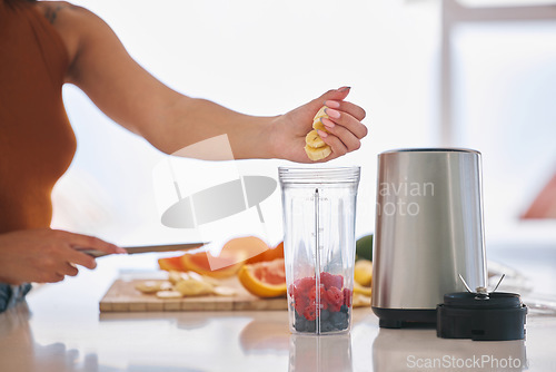 Image of Fruit, smoothie and morning with hands of woman in kitchen for gut health, diet and breakfast. Wellness, detox and nutrition with closeup of female person at home for cooking, juice and weight loss