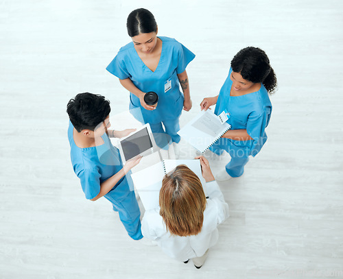 Image of Teamwork, tablet or above of doctors in meeting planning a surgery strategy in collaboration together. Top view of healthcare nurses talking or speaking of online news reports, feedback or research