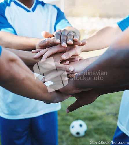 Image of Hands stacked, sports and men on a soccer field for support, motivation and team spirit. Goal, training and athlete football players with a gesture for celebration, solidarity and trust at a game