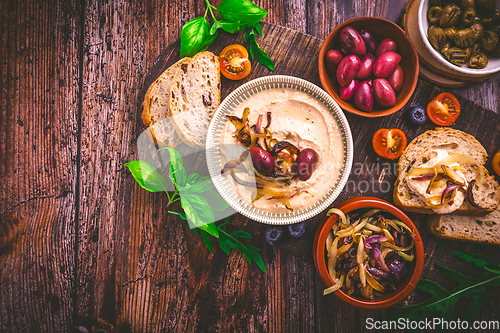 Image of Whipped feta cheese dip with garlic, olives, lemon and carameliz