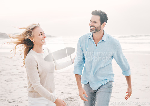 Image of Love, happy and couple laughing on beach for holiday, vacation and weekend for anniversary. Travel, marriage and happy mature man and woman walking for bonding, quality time and happiness by ocean