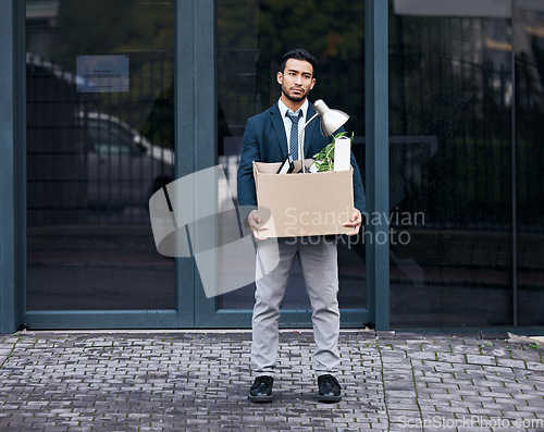 Image of Depression, economy and box with a jobless business man walking outdoor in the city alone. Financial crisis, unemployment and fired with a young asian male employee looking sad in an urban town