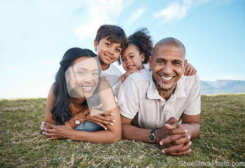 Image of Family, portrait and relax parents in garden with mother, father and kids together with love. Face, top view and dad with mom and children with parent support and care on a lawn with happy smile