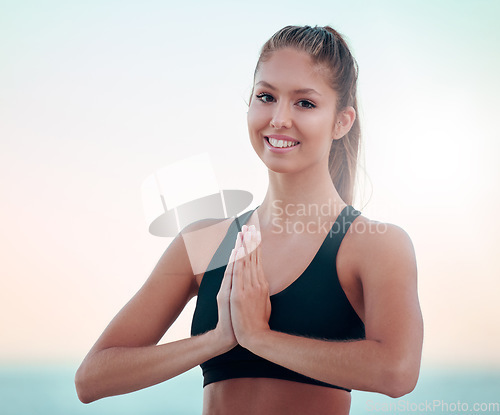 Image of Yoga, fitness and portrait of woman with praying hands for spiritual wellness, holistic meditation or outdoor health. Calm, peace and prayer and face of young person meditate, namaste or zen training
