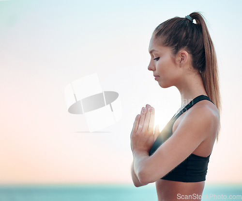 Image of Yoga, praying hands and woman sky mockup for spiritual wellness, holistic meditation and peace or outdoor health. Calm, faith and prayer sign or hope of young person meditate, namaste or zen at ocean