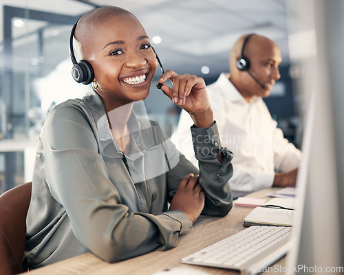 Image of Consultant, woman call center agent with headset and computer for online communication at office. Customer service or crm , telemarketing or consulting and African female smile at her workstation