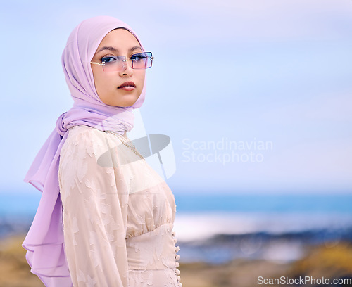 Image of Portrait, fashion or sunglases with a muslim woman on mockup outdoor in a scarf for contemporary style. Islam, faith and hijab with an edgy young arab female person posing outside in modern eyewear