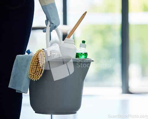 Image of Hands, cleaner and bucket of supplies for cleaning, hygiene or disinfection at the office. Hand of person, housekeeper or maid holding clean equipment, supply or tools for bacteria or germ removal