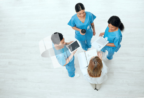 Image of Teamwork, tablet or above of nurses in meeting planning a surgery strategy in collaboration together. Top view of healthcare doctors talking or speaking of online news reports, feedback or research