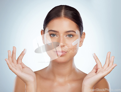 Image of Skincare, face and beauty of woman with sunscreen in studio isolated on a white background. Portrait, dermatology cream and female model apply cosmetics, lotion or moisturizer product for skin health