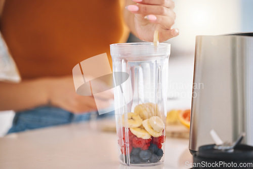 Image of Fruit, smoothie and breakfast with hands of woman in kitchen for gut health, diet and milkshake. Wellness, detox and nutrition with closeup of female person at home for cooking, juice and weight loss