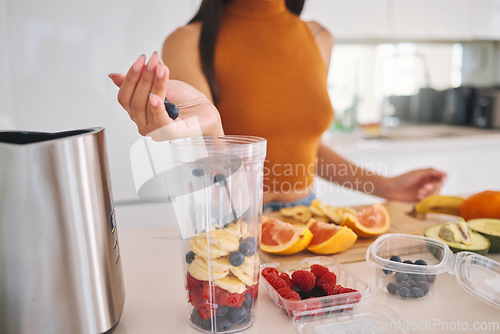 Image of Fruit, smoothie and detox with hands of woman in kitchen for gut health, diet and breakfast. Wellness, blender and nutrition with closeup of female person at home for cooking, juice and weight loss