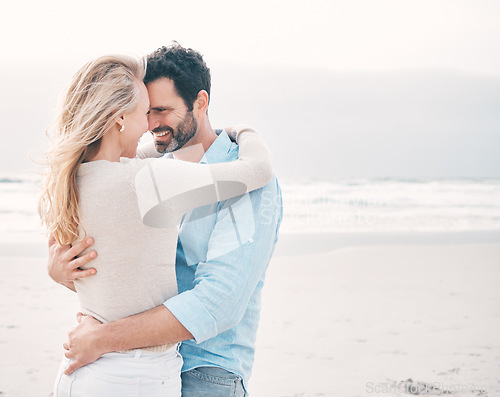 Image of Travel, beach and couple touching forehead on holiday, vacation and weekend for anniversary. Intimacy, marriage and happy mature man hugging woman for bonding, quality time and happiness by ocean