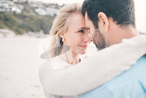 Image of Beach, love and couple touching face on holiday, vacation and romantic weekend for anniversary. Intimacy, marriage and happy mature man hugging woman for bonding, quality time and happiness by ocean