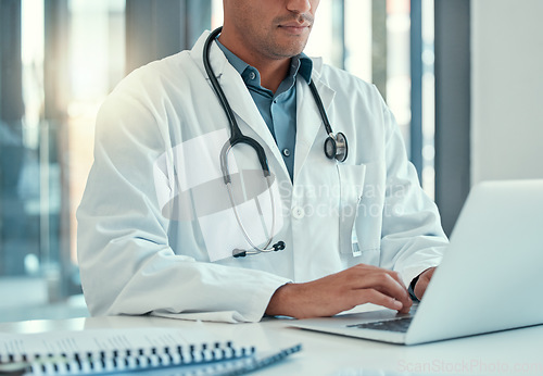 Image of Laptop, doctor hands and man typing for research, healthcare or telehealth in wellness hospital. Computer, medical professional or person with email, online consultation or writing health information