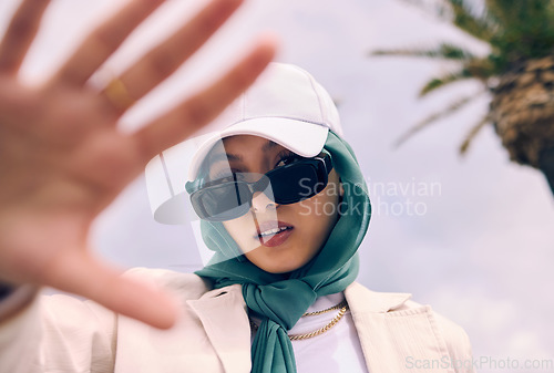 Image of Muslim woman, fashion selfie and portrait in city, street and gen z aesthetic for beauty, blog and post. Young islamic girl, student and influencer with sunglasses, social media and travel in Dubai