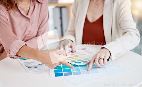 Image of Hands, color pallet and business women in a meeting for design, decision and choice discussion. Fingers, closeup and female designer team with different shades on paper, creative and collaboration