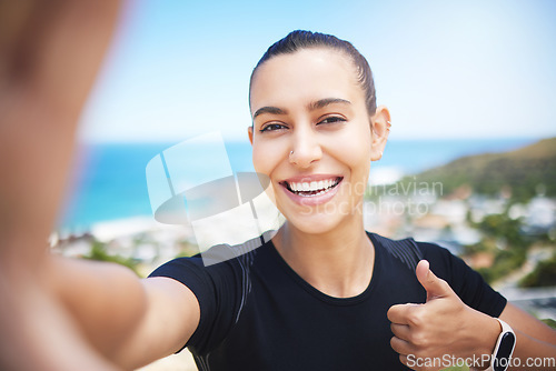 Image of Runner woman, mountain selfie and fitness portrait with energy, smile and training for wellness on social media. Girl, influencer and profile picture with ocean, cityscape and thumbs up in summer