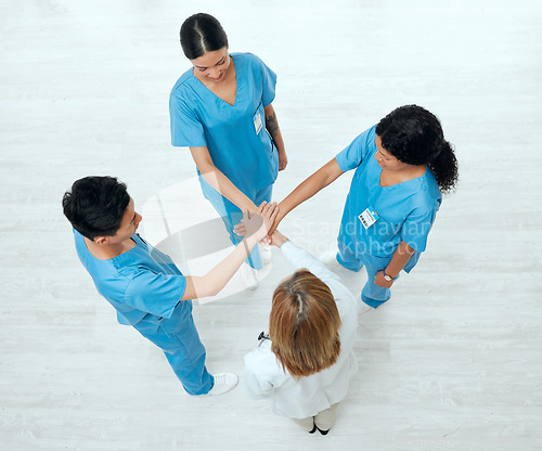 Image of Above, teamwork or hands of doctors in stack in meeting collaboration for healthcare targets or goals. About us, team building or top view of medical nurses with group support, motivation or mission