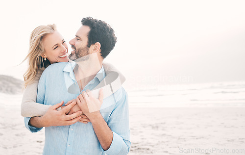 Image of Travel, happy and couple hug at beach for holiday, vacation and romantic weekend for anniversary. Love mockup, marriage and mature man hugging woman for bonding and happiness by ocean with space